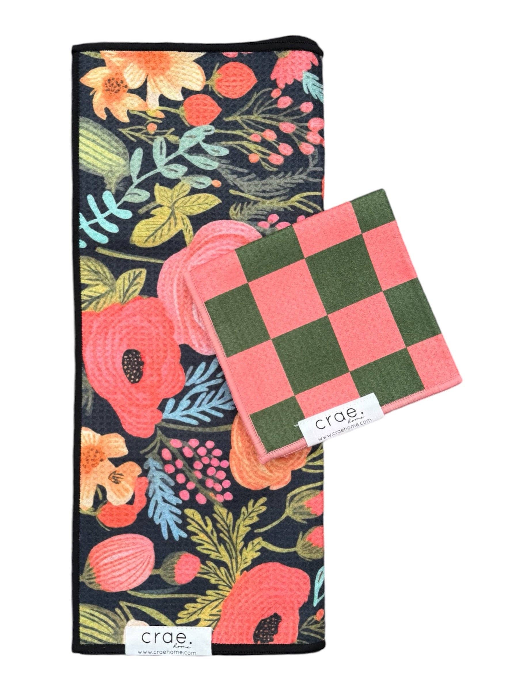 Crae Colleen/Melon towel set with floral black hand towel and pink-green checkered washcloth.