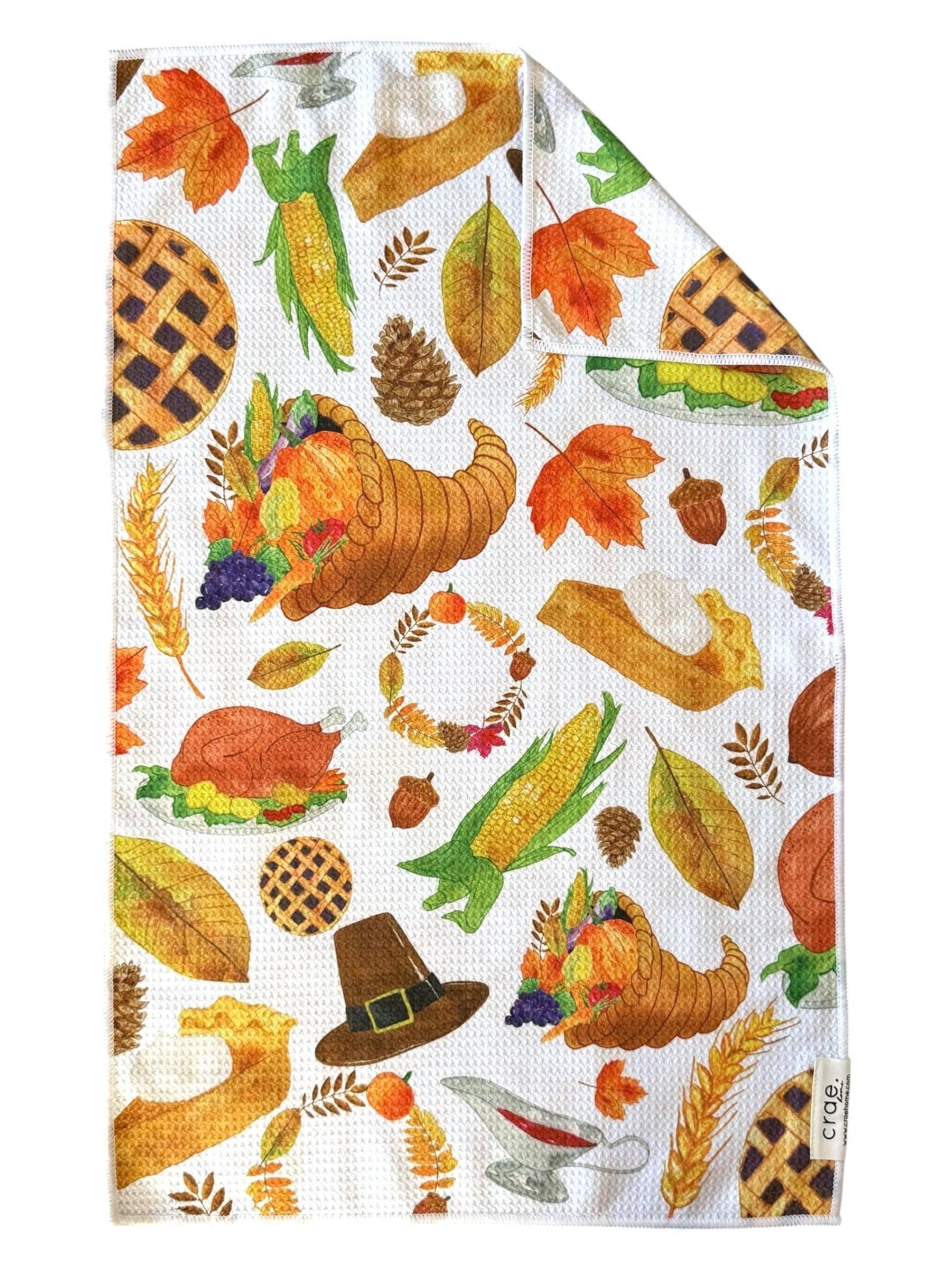Crae Cornucopia microfiber hand towel, 17x27 in, white with colorful Thanksgiving pumpkins, cornucopias, and turkeys.