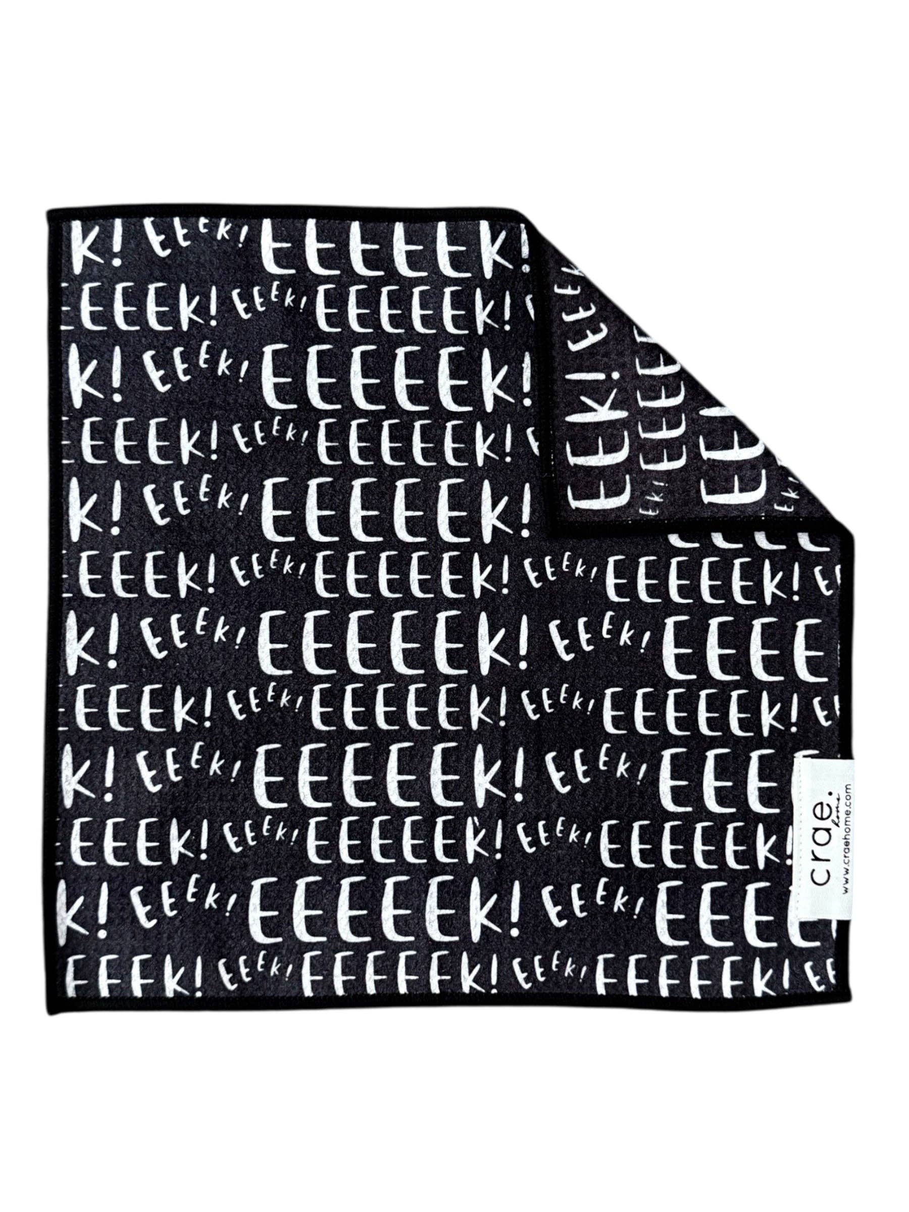 EEEEEk microfiber washcloth, 12x12 in, black with repeating white “EEEEEk” Halloween lettering.