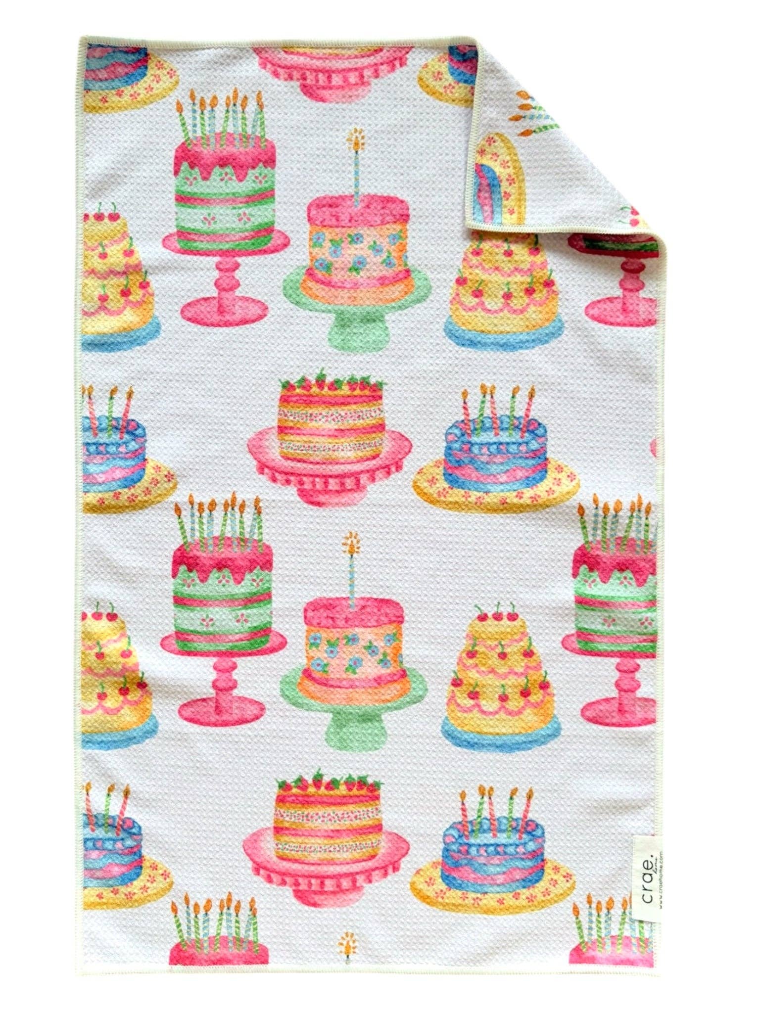 Crae Make A Wish microfiber hand towel, 17x27 in, white with colorful birthday cakes and candles.