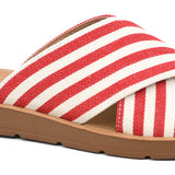 Red and white striped sandal with a brown sole on a white background
