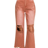 Rust colored distressed knee jeans with raw hemline
