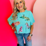 Mint  short sleeved tee with sequin safari animals.