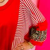 Close up of Red, stripe, and leopard oversized Dolman style long sleeve sweatshirt.