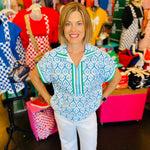 blue and white geometric floral half zip top