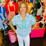 blue and white geometric floral half zip top