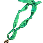 Green scarf necklace with football charm.
