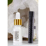 Thomas Blonde - A sleek, metallic, cylindrical car vent diffuser clip with a white dot for adjusting fragrance.