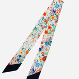 Colorful floral scarf necklace with bright reds, yellows, purples, blues, and green accents