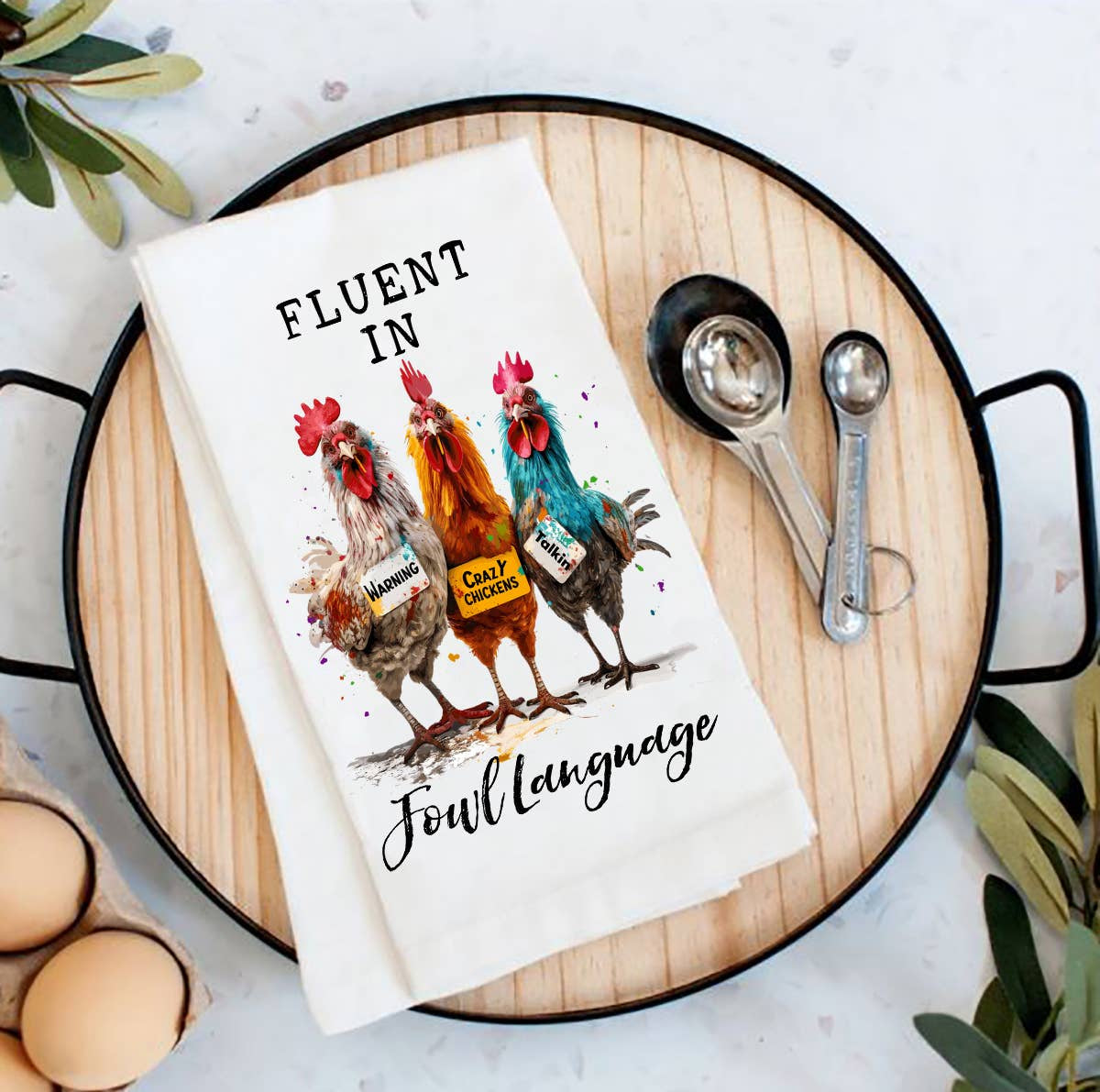 White cotton tea towel with three colorful chickens and witty farmhouse text design.