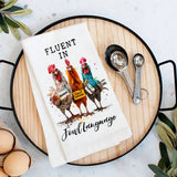 White cotton tea towel with three colorful chickens and witty farmhouse text design.