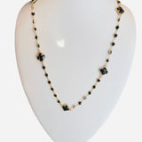 Gold necklace with black diamond-inspired accents and clover pendant, 28–30 inches, bold and elegant