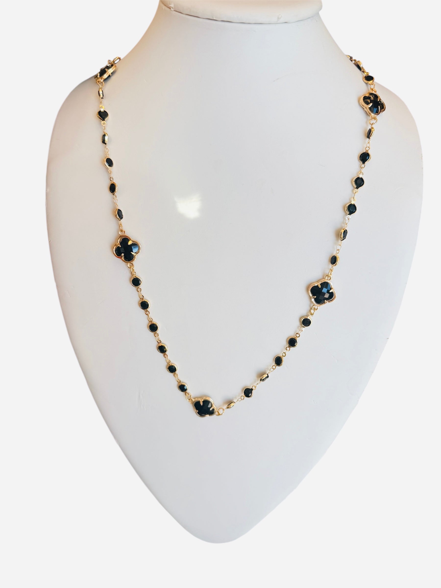Gold necklace with black diamond-inspired accents and clover pendant, 28–30 inches, bold and elegant