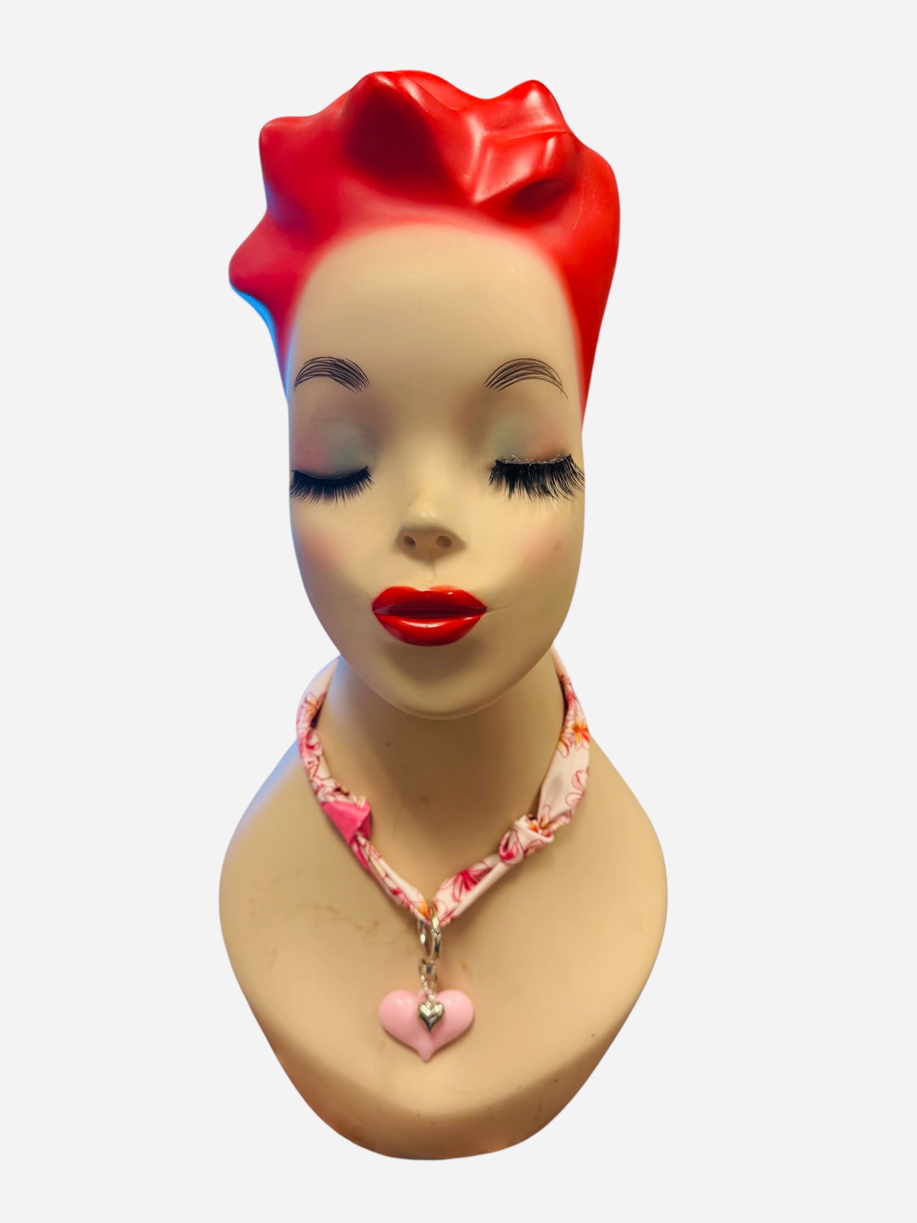 Pink and ivory floral scarf necklace with puffy pink heart charm and silver heart charm, tied in a stylish knot and designed to be worn as a necklace, bracelet, or accessory.