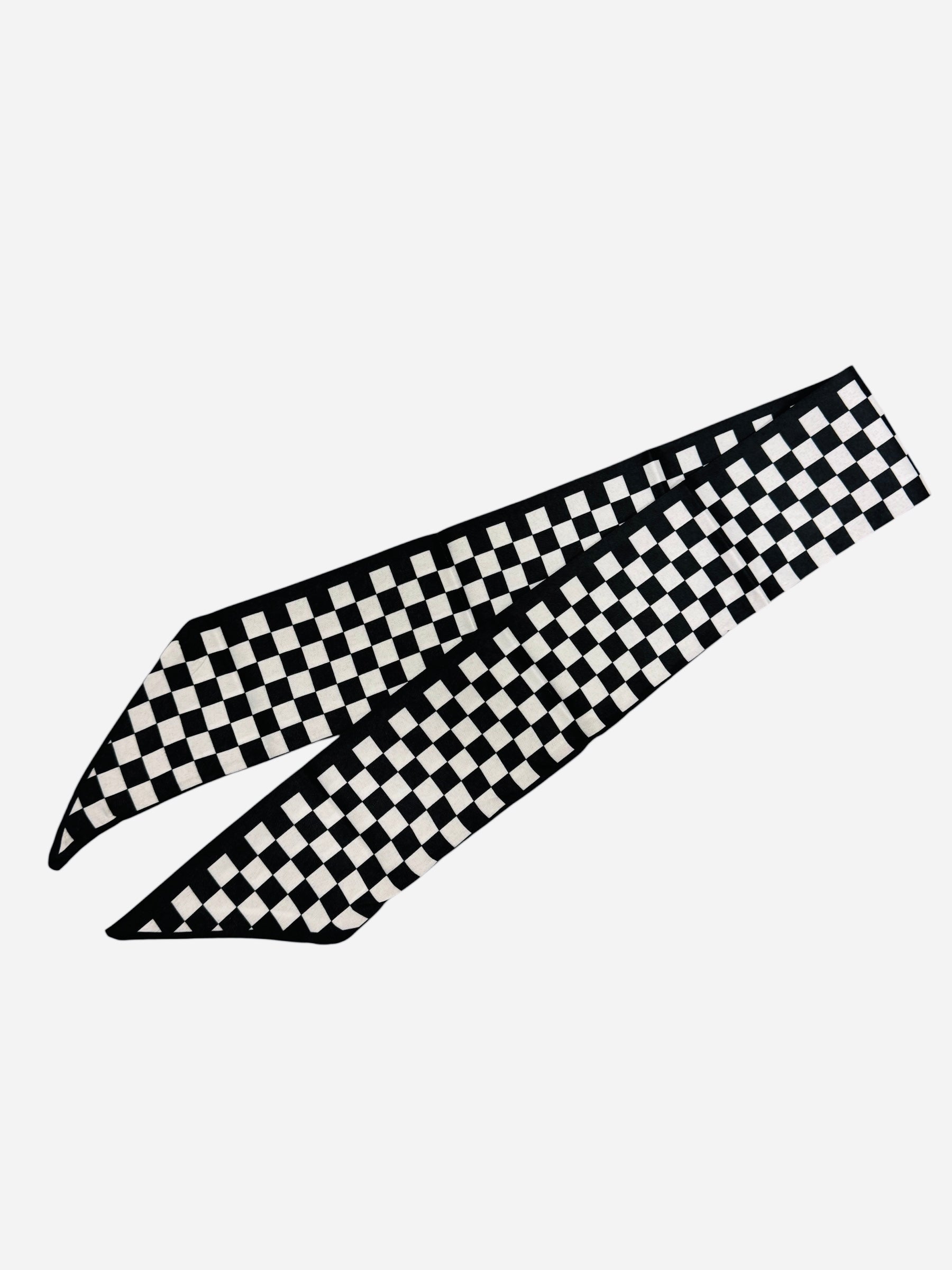 Black and white checkered scarf tie styled as twilly or chic scarf necklace.