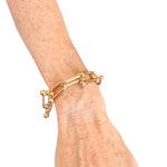 Gold linked bracelet with water-resistant finish, perfect for daily wear and stylish layering.
