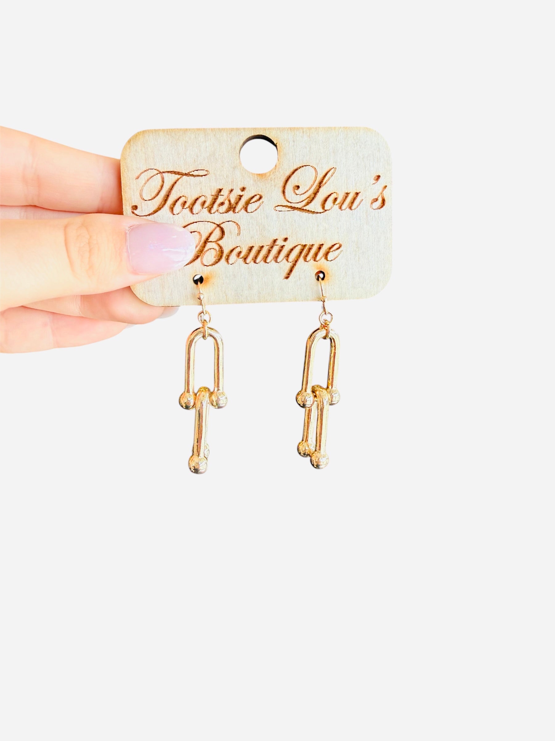 Gold linked earrings with interlocking chain design, water-resistant and lightweight for everyday wear.