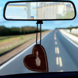 Heart-shaped leather and cowhide car freshener charm, handcrafted, reusable with scented oil mists, ideal for car, home, or camper.
