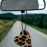 Heart-shaped leather and cowhide car freshener charm, handcrafted, reusable with scented oil mists, ideal for car, home, or camper.