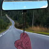 Heart-shaped leather and cowhide car freshener charm, handcrafted, reusable with scented oil mists, ideal for car, home, or camper.