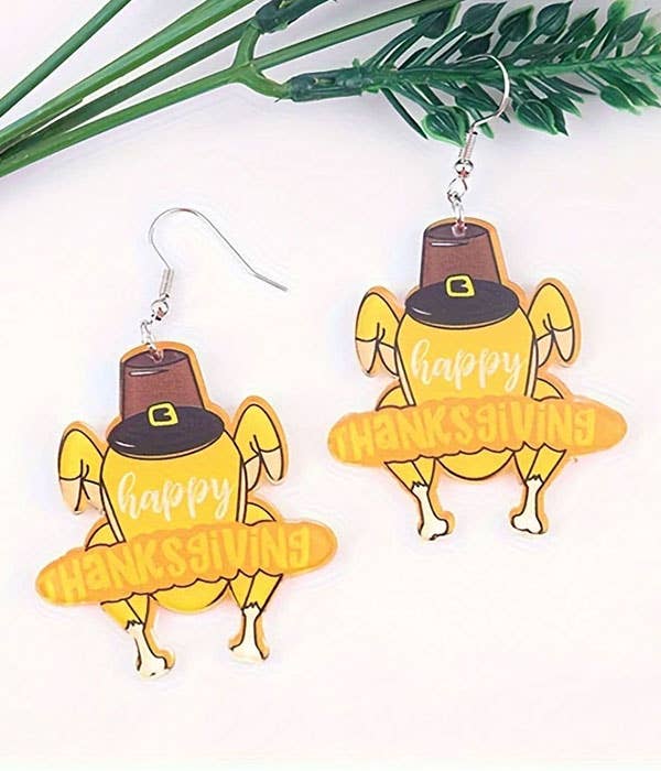 Thanksgiving turkey earrings made of acrylic in fall colors with laser-cut detail and festive charm.