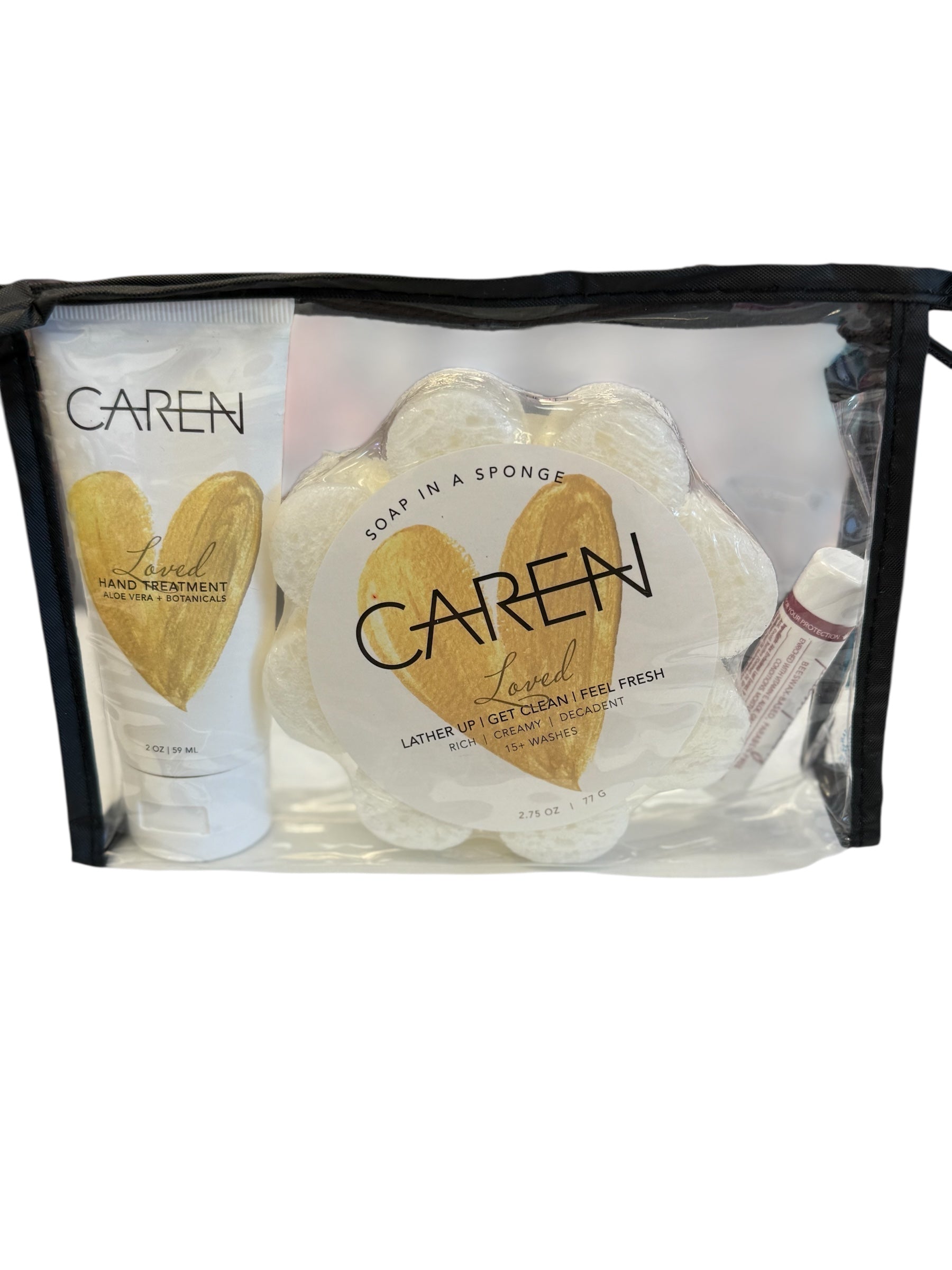 A pampering gift set including Loved hand cream, a soap sponge, and lip balm.