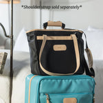 Alamo Heights Tote in coated canvas with natural leather trim and lining.