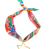 Multicolored retro-print scarf necklace featuring a hammered gold open star charm; vibrant hues of pink, teal, orange, and yellow add a playful, bold touch to any outfit.