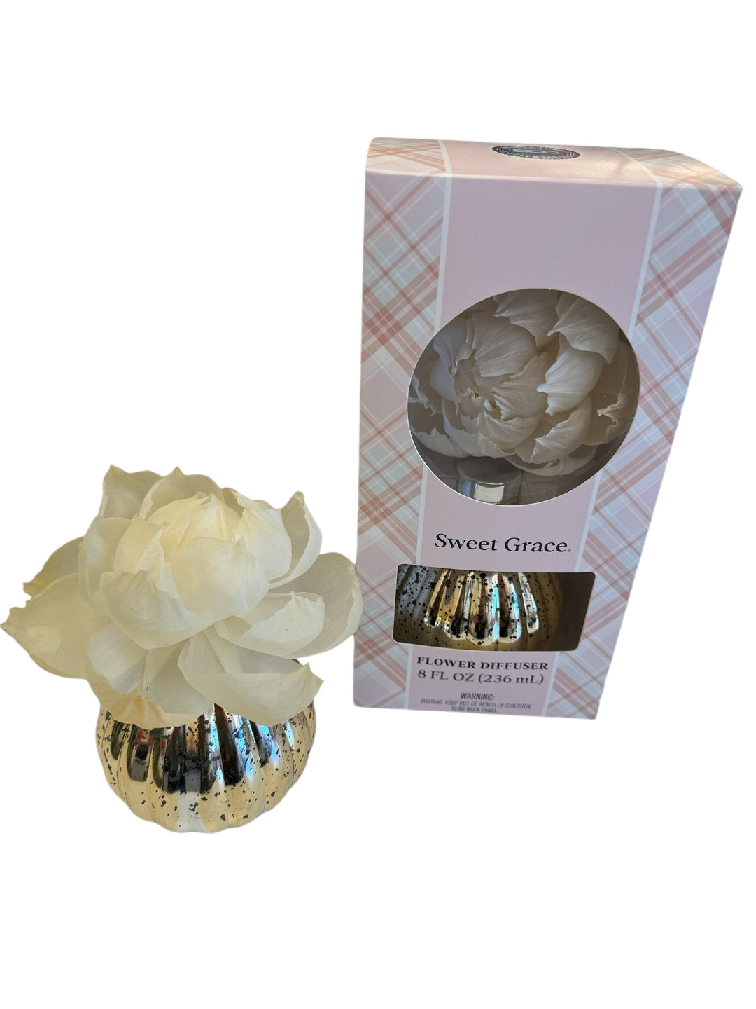 A Sweet Grace flower diffuser with a pink and white floral design, accompanied by a packaging box with a tartan pattern.