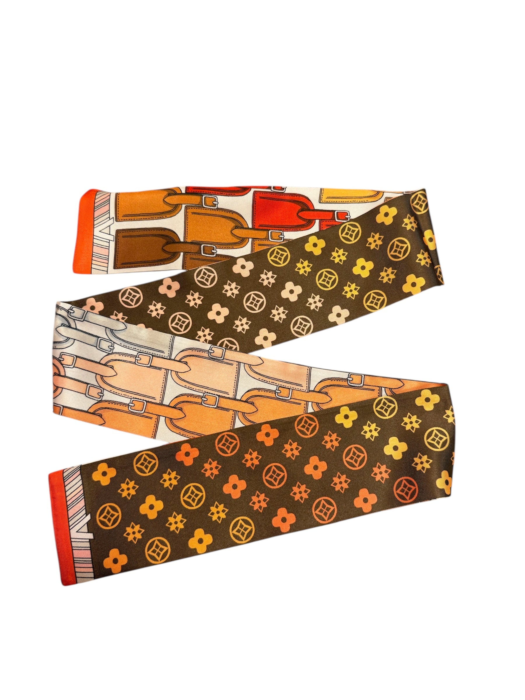 The Brown Travelers Scarf Tie features reversible floral and luggage tag prints — wear as scarf, twilly, or necklace.