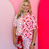 Mid-body shot focusing on the fit and details of the pajama set, including the soft fabric and ruffle trim on the shorts.