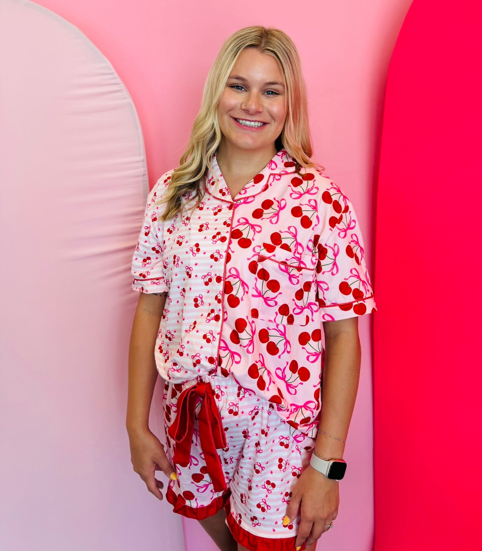 Mid-body shot focusing on the fit and details of the pajama set, including the soft fabric and ruffle trim on the shorts.