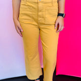 Close view of gold crop wide-leg jeans showing high-rise waistband, wide leg cut, and front pocket detail.