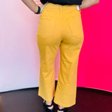 Rear view of gold crop wide-leg jeans with high-rise waist and two back patch pockets.