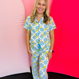 Classic button-down lounge top in soft, stretchy fabric with relaxed fit, contrast piping, and short sleeves.