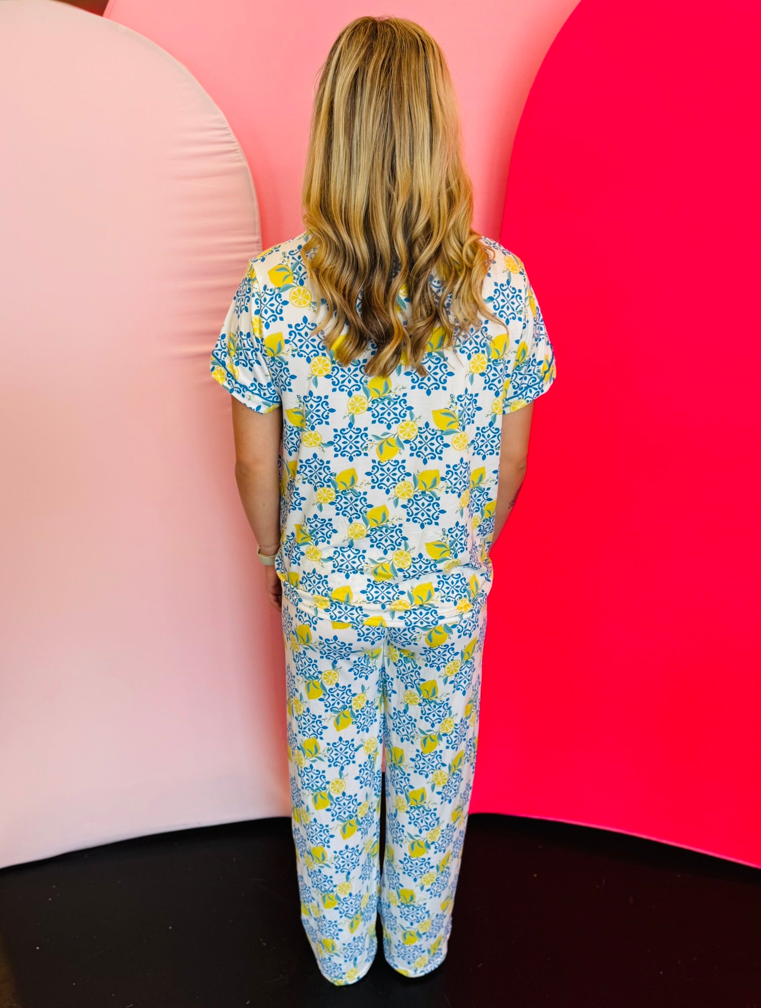 Wide-leg lounge pants in soft, stretchy fabric with elastic waistband, & drawstring tie.