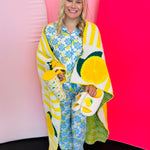 Lounge top paired with matching pajama bottoms, shown alongside coordinating cup, slippers, and blanket in the same design for a complete set.
