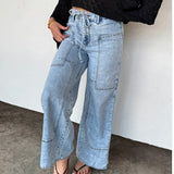 Light denim boho-inspired jeans with tie waist and front panel pockets, ideal for summer styling.