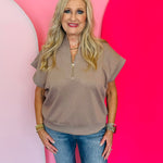 Cocoa brown half-zip high neck top made of soft scuba knit fabric, offering a relaxed and stylish everyday look.