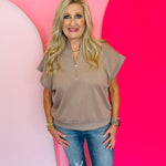 Cocoa brown half-zip high neck top made of soft scuba knit fabric, offering a relaxed and stylish everyday look.
