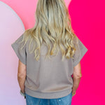 Cocoa brown half-zip high neck top made of soft scuba knit fabric, offering a relaxed and stylish everyday look.
