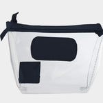 Jon Hart Airport Chico clear TSA-compliant travel pouch with navy Natural Leather trim, flat bottom, and zippered brass closure—perfect for carrying 3oz liquids and travel essentials.
