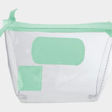 Jon Hart Airport Chico clear TSA-compliant travel pouch with pistachio Natural Leather trim, flat bottom, and zippered brass closure—perfect for carrying 3oz liquids and travel essentials.