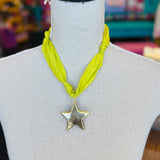 Lime green scarf necklace with a gold star charm, displayed on a neutral background. Lightweight and playful, this accessory adds a pop of color and whimsical shine to any outfit.