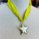 Lime green scarf necklace with a gold star charm, displayed on a neutral background. Lightweight and playful, this accessory adds a pop of color and whimsical shine to any outfit.