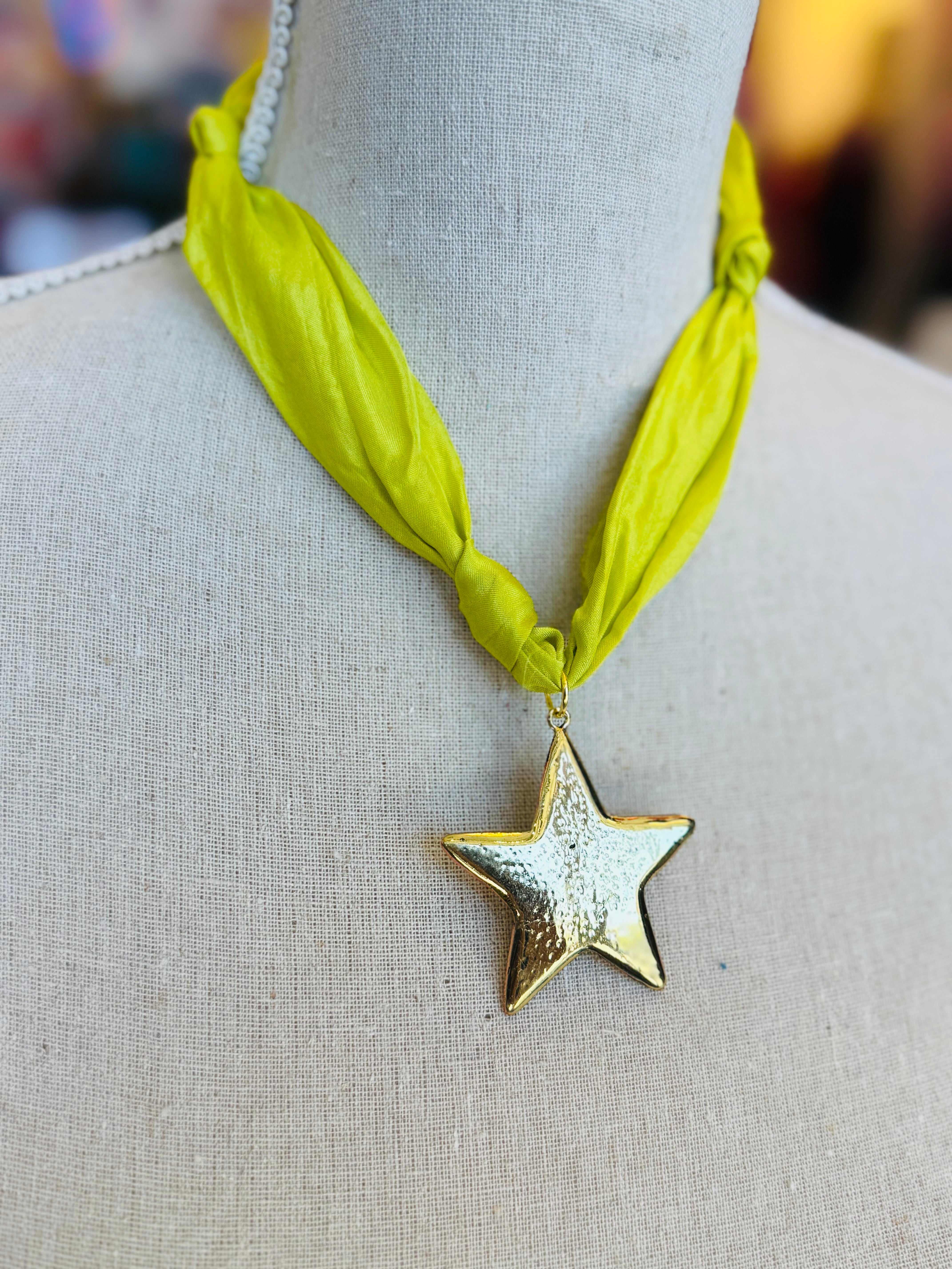 Lime green scarf necklace with a gold star charm, displayed on a neutral background. Lightweight and playful, this accessory adds a pop of color and whimsical shine to any outfit.