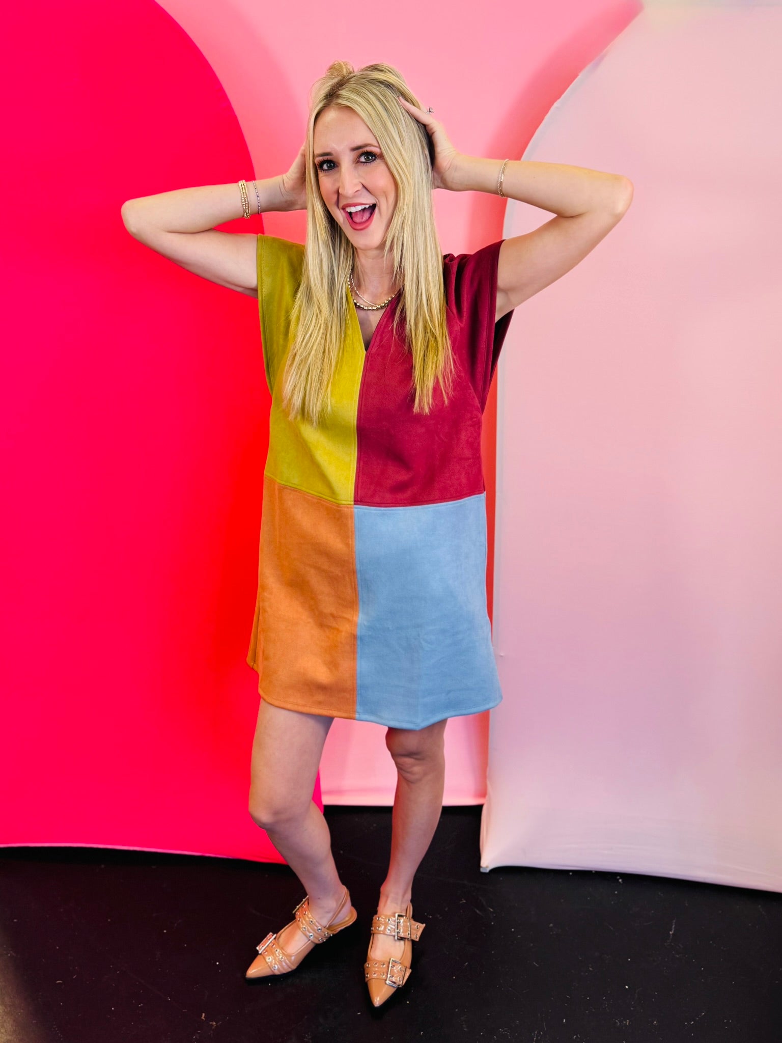 Bright autumn colorblock mini dress with burgundy, mustard, orange, and light blue panels, short sleeves, and a V-notch neckline.