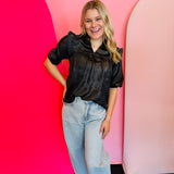 Black metallic ruffle blouse with V-neck and 3/4 sleeves.