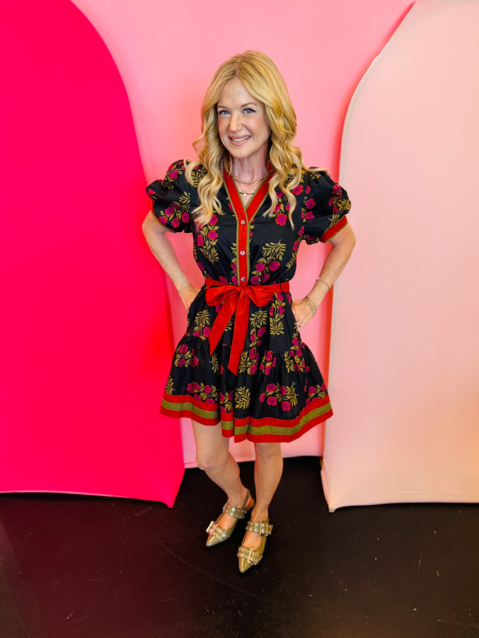 Black & Red Floral Dress with short puff sleeves, ruffle hem, removable belt, and side pockets.