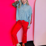 Red high-rise kick flare cropped jeans with stretchy fabric and bold, vibrant statement-making style